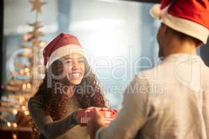 I saw this and thought of you. Shot of two young businesspeople celebrating Christmas at work.