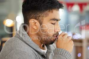 This cough is getting bad. Cropped shot of a young man coughing.