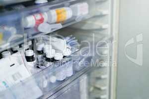 Stocked with life saving drugs. Shot of shelves stocked with medication in a hospital.