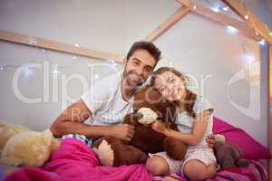 Dad always makes time to treasure with his little girl. Portrait of a father and his little daughter bonding together at home.