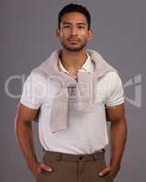 Focused passion, confidence, nonconformity and honesty. A recipe for success. Studio shot of a handsome young man posing against a grey background.