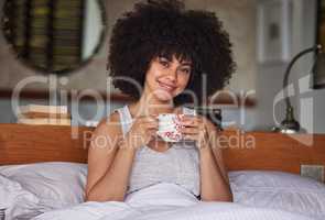 How could he know he had found treasure. Portrait of a beautiful young woman having a cup of coffee in bed at home.