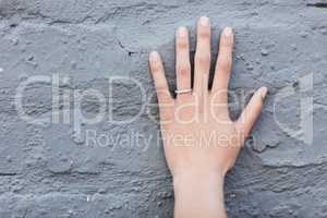 The symbol of commitment. Cropped shot of an engagement ring on an unrecognizable womans hand.