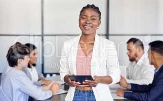 Nothing stopped her hustle. Shot of a young businesswoman in the middle of a meeting.