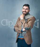 Let your style reflect who you are. Studio shot of a stylishly dressed young man posing against a grey background.