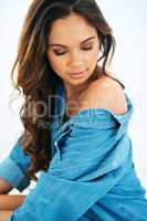 Be as beautiful as you can be. Cropped shot of a beautiful young woman posing in a denim shirt.