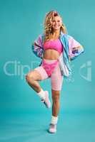The 80s was quite a colourful era. Studio shot of a beautiful young woman wearing a 80s outfit.