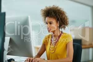 She brings a singular focus to every task. Shot of a businesswoman working on her computer in the office.