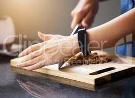 Decide to make one part of your life easy. Shot of an unrecognisable woman preparing a healthy meal at home.
