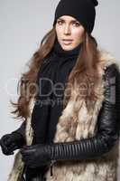 Fall fashion. Gorgeous young woman dressed in luxurious winter fashion.
