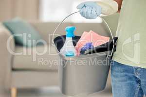 My home will be a bastion of cleanliness. Shot of a man holding a bucket of cleaning supplies.