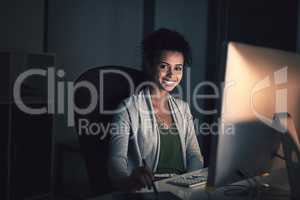 Great results require a dedicated amount of hours. Portrait of a young businesswoman working late on a computer in an office.