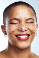 If feels good living for me. Studio shot of a beautiful young woman posing with glitter freckles on her face.