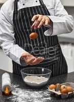 Calling all carb-oholics. Shot of an unrecognisable man preparing freshly made pasta.