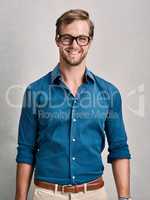 Defined by his style. Cropped portrait of a handsome young man posing in the studio.