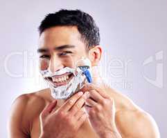 If youre like me, you like taking it all off. Cropped shot of a handsome young man shaving his facial hair.