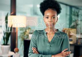 You dont need permission to achieve greatness. Portrait of a confident young businesswoman standing in an office.
