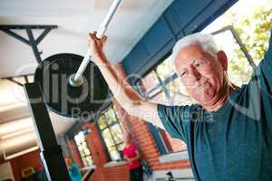 Be mentally stronger than what you physically feel. Shot of a senior man doing weight training at the gym.