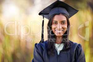 Look out world, Im coming. Cropped portrait of an attractive young female student celebrating on graduation day.