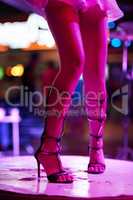 Putting on a show for the clientel. Cropped shot of a womans legs dancing on stage in a Thai nightclub.