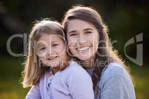 I cant imagine my life without her. Cropped portrait of an attractive young woman and her daughter posing outside in the garden at home.