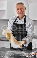 Craving carbs Ive got you covered. Portrait of a mature man preparing freshly made pasta.