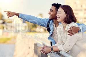 Isnt that beautiful. Shot of a young couple exploring a city together.