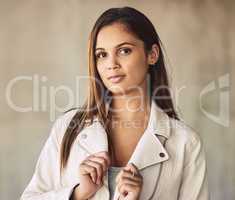 To the left of that decimal, hard work doesnt scare us. Portrait of an attractive young woman posing outdoors against an urban background.