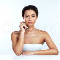 For her its effortless to look this good. Portrait of an attractive young woman posing against a white background.