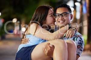 They have so much fun when they get together. Shot of a happy young couple spending the night out in the city.