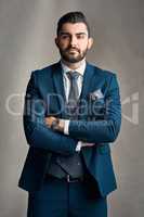 I dont accept ant anything but the best. Studio portrait of a stylishly dressed and confident young businessman posing against a grey background.