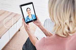Medical advice is just a tap away. Shot of a woman on a video call with a medical practitioner.