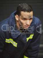 My career is based on life and death. Shot of a handsome young male firefighter planning his next move.