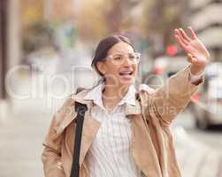 Panic is anxiety on fire. Shot of a beautiful young woman trying to hail a cab while out in the city.