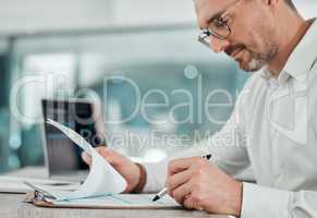 All company finances seem to be in order. Shot of a mature businessman sitting alone in his office and calculating his finances.