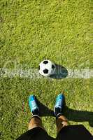Ready for kick-off. POV shot of a soccer player standing on the field.