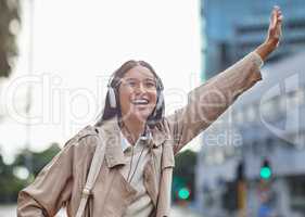 I hope this cab stops for me. Shot of a young businesswoman hailing a cab in town.