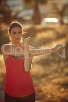 Its all part of the running lifestyle. Shot of a sporty young woman exercising outdoors.