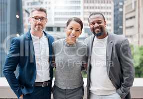 Learned the value of working hard, by working hard. Portrait of a group of businesspeople enjoying a break outside at the office.