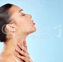 Be addicted to bettering yourself. Studio shot of an attractive young woman posing against a blue background.