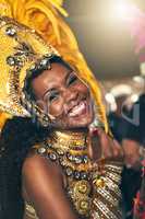 The rhythm comes from within. Cropped portrait of a beautiful samba dancer performing at Carnival with her band.