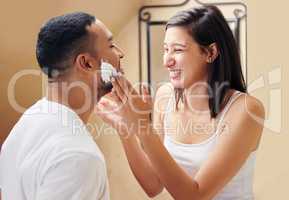 Today is your special day and you deserve to be pampered. Shot of a woman putting shaving cream on her boyfriends face.