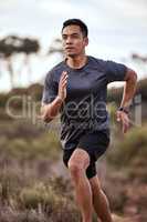 Running clears the mind of all worries. Shot of a young man exercising in nature.