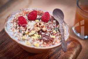 Low fat and full of flavour. Shot of a delicious breakfast meal served with fruit, nuts and seeds.