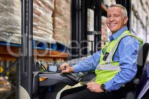 You need to think beyond your competitor. Shot of a mature man working on a forklift in a warehouse.
