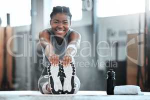 Leave regret to yesterday. Portrait of a young beautiful woman doing stretches and exercising at the gym.