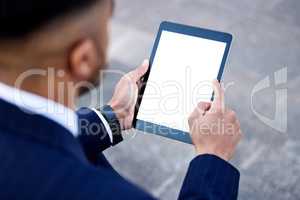 This work needs to be done immediately. Shot of a businessman using a digital tablet.