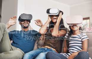 The future of family entertainment is here. Shot of a young family using virtual reality headsets together at home.