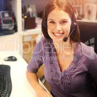 Directing calls to the correct departments. Cropped portrait of a young businesswoman wearing a headset at her desk.