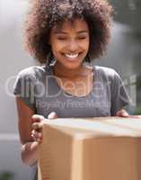 Delivering direct to your door. Shot of a courier making a delivery to a smiling customer.